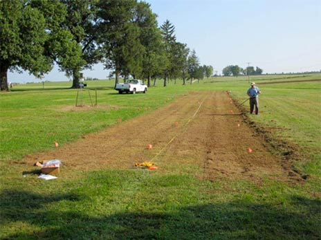 Image of a lawncare operator establishing habitat in a vertically mowed section.